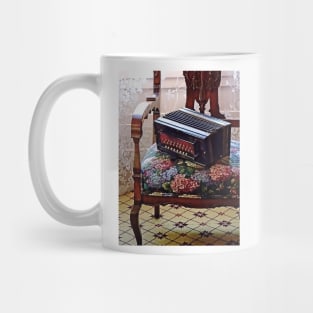 Button Accordion on Chair With Flowered Seat Mug